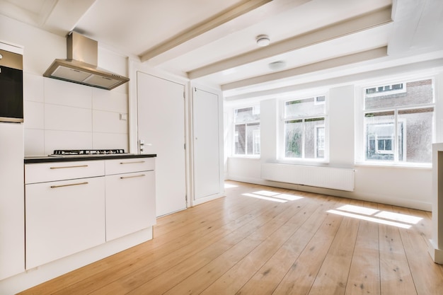 The interior of an elite room with a small kitchen area