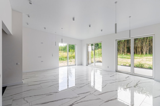 Interior of empty apartment wide room with marble floor