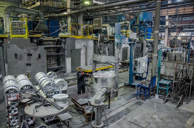 Interior of a foundry - workstation and equipment for the production alloy wheels. Industrial zone