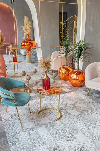 Interior of a large apartment in oriental mixed with loft style with arches led lighting and bright orange elements