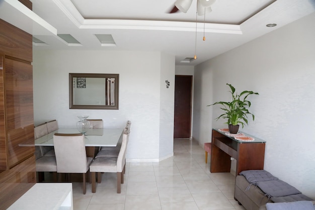 Interior living room in a house with table and brown ceiling fan