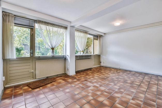 The interior of a luxurious room with a tiled brown floor