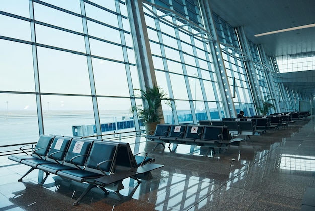 Interior of modern airport at daytime with no people inside it