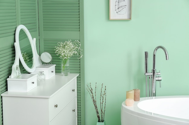 Interior of modern bathroom with floral decor