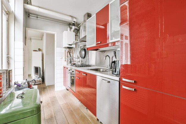 Interior of modern kitchen with red furniture