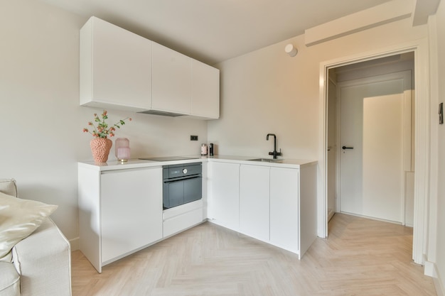 Interior of modern kitchen with white cabinets