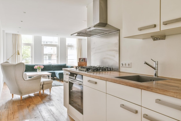 Interior of modern kitchen with white furniture