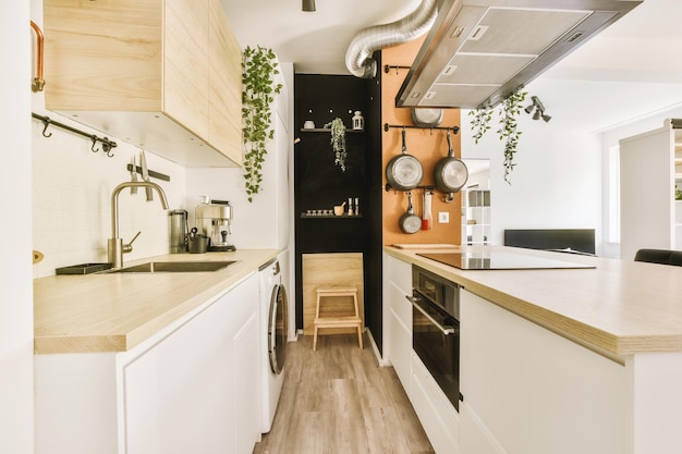 Interior of modern kitchen with white furniture