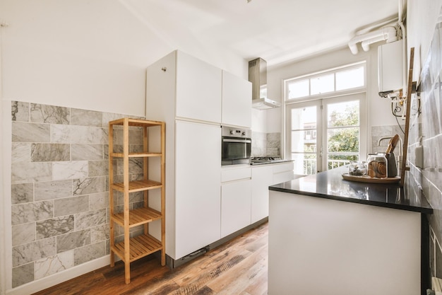 Interior of modern kitchen with white furniture