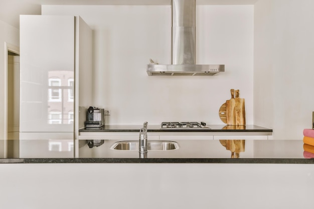 Interior of modern kitchen with white furniture