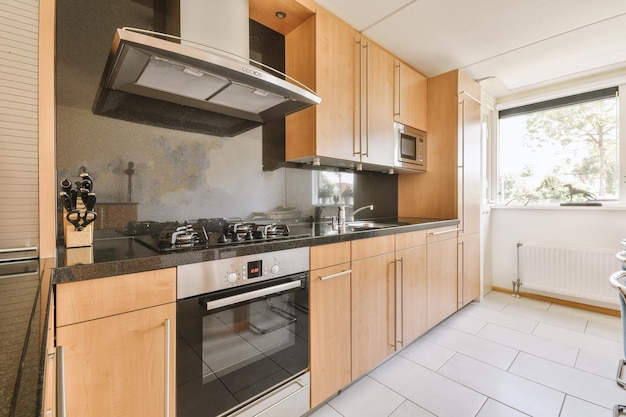 Interior of modern kitchen with white furniture