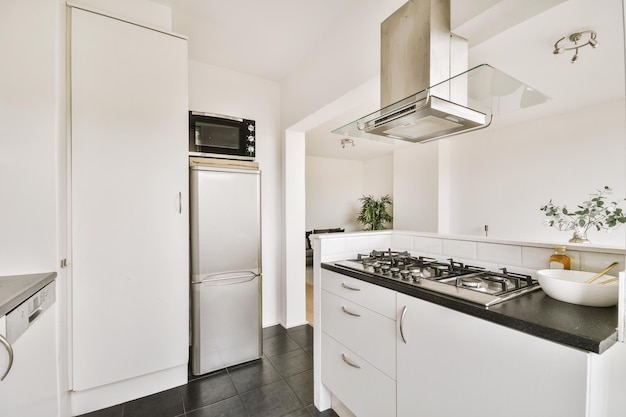 Interior of modern kitchen with white furniture