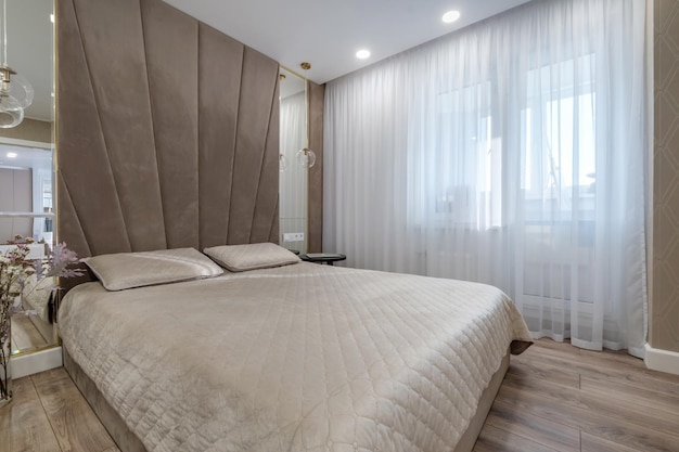 Interior of the modern luxure bedroom in studio apartments