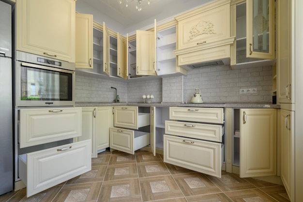 Interior of modern trendy cream colored kitchen