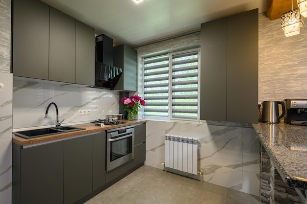 Interior of modern trendy grey kitchen