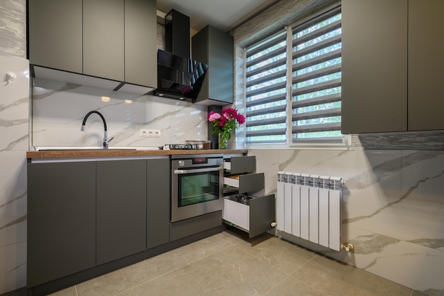 Interior of modern trendy grey kitchen