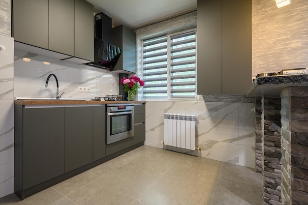 Interior of modern trendy grey kitchen