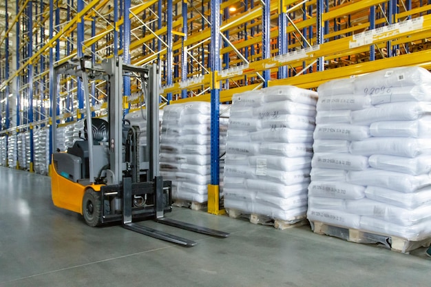 Interior of a modern warehouse with forklifts Pallet stacker truck equipment at warehouse Forklift loader