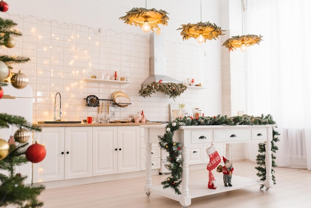 Interior of a modern white kitchen on Christmas Eve in a Scandinavian style