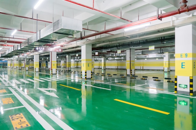 interior of parking garage with car and vacant parking lot in parking building