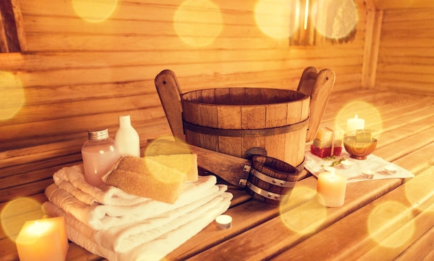 Interior of sauna and sauna accessories on background