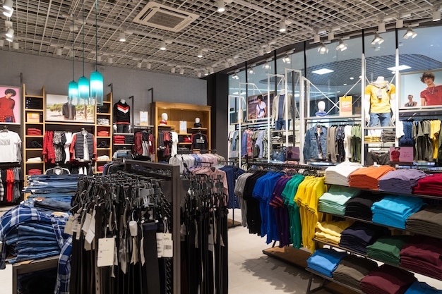 interior shot of racks with shirts, undershirts and jeans