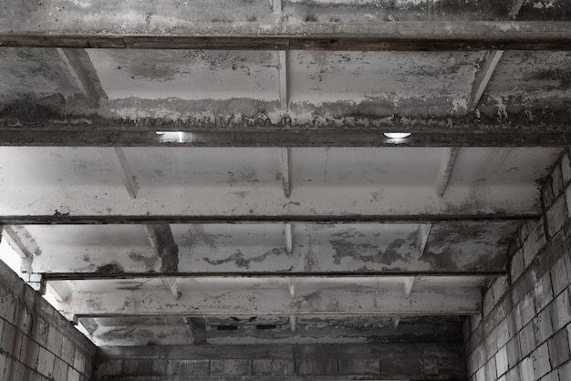 Interior structure of garage under construction ceiling made of horizontal reinforced concrete slabs Construction site