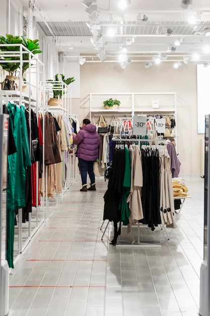 The interior of a women's clothing store in a shopping center. Style and fashion. Vertical.