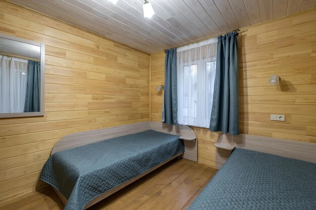 interior of wooden eco bedroom in studio apartments hostel or homestead