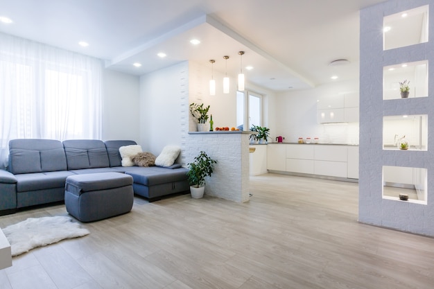 internal shot of a modern kitchen in foreground the water tap and kitchen sink