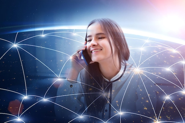 International call support conceptCustomer service operator woman with mobile phone and global mapsmilingElement of the image provided by NASA