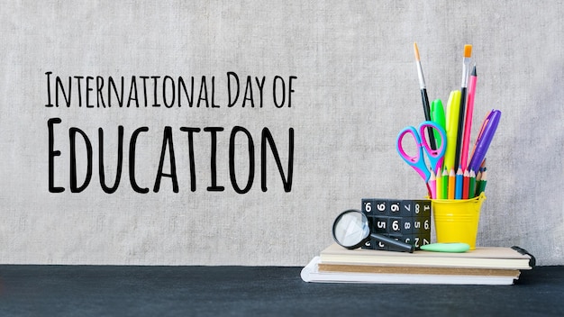 International day of education concept with color school supplies on desk international education