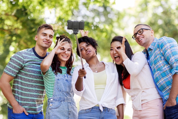 international friends taking selfie in park