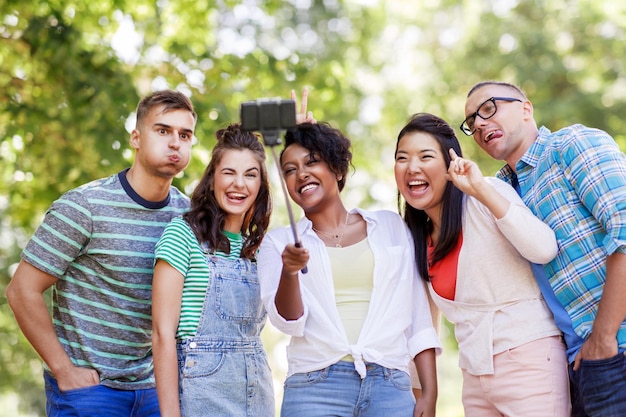 international friends taking selfie in park