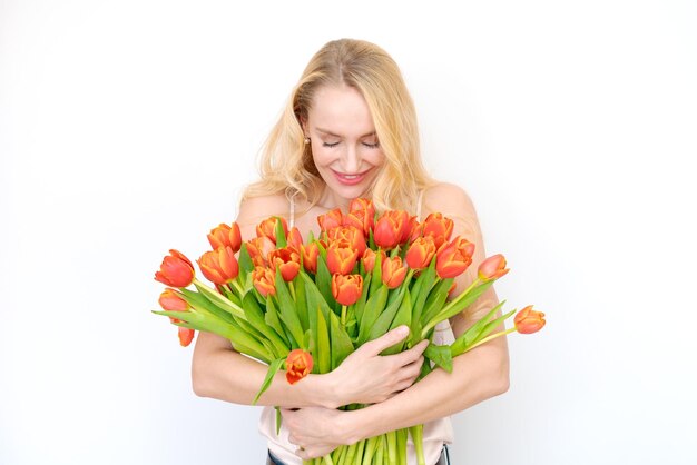 International Women's Day Extremely happy woman holding bouquet spring