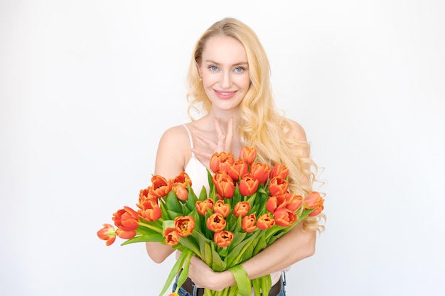 International Women's Day Extremely happy woman holding bouquet spring