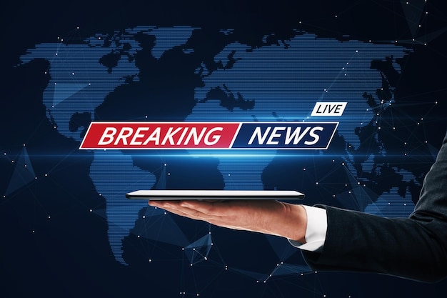 Internet and digital online news concept with template of breaking news live sign above man hand with digital tablet