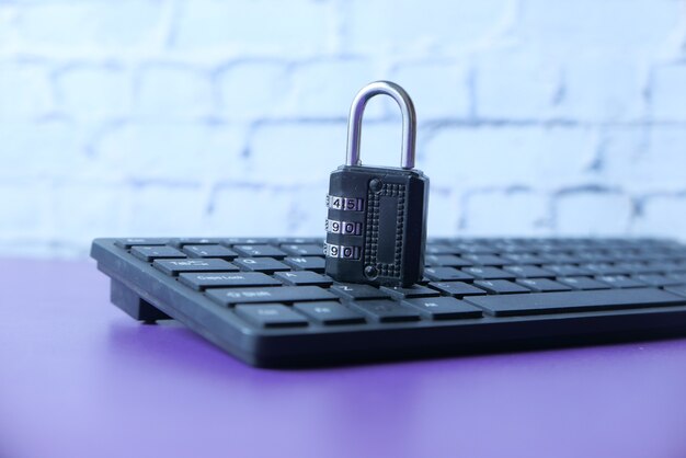 Internet safety concept with padlocked on computer keyboard