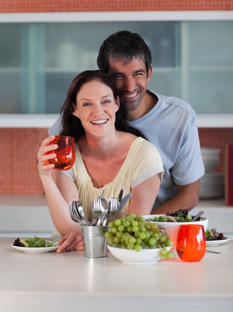 Intimate couple standing in the kitchen