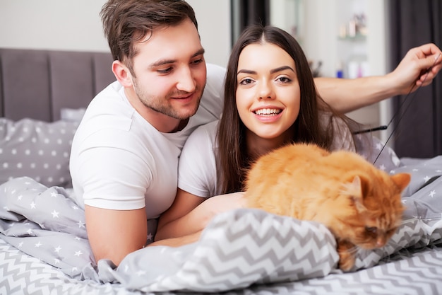 Intimate sensual young couple in bedroom enjoying each other