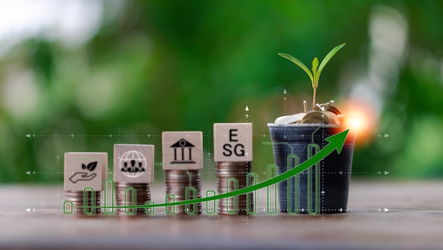 Investing in the environment society governance ESG Investing in the industrial Green energy invest instead gold coins growing Concept of Savings in ESG Mutual Funds Sustainable Business