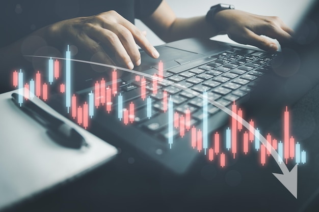 Investor analyze stock chart with laptop businessman forecast and analysis graph