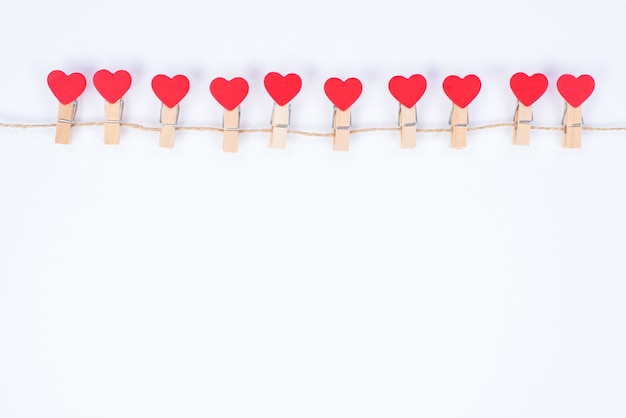 Invitation message on valentine's day concept. Photo of beautiful lovely dream cute clothespins handing on rope isolated white color background