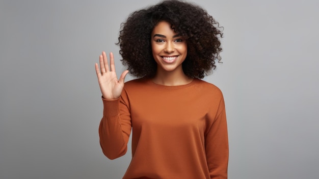 Inviting Young African American Woman in Casual Attire with a Natural Smile and Open Hand Gestures