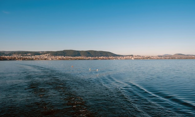 Ioannina city Epirus Greece Panoramic view of Giannena Pamvotis Lake water blue sky background