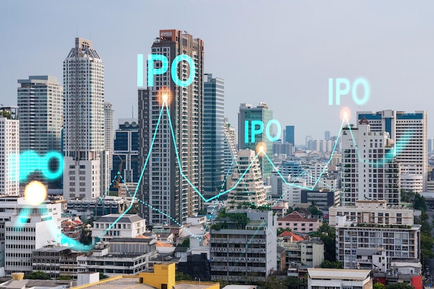 IPO icon hologram over panorama city view of Bangkok the hub of initial public offering in Asia The concept of exceeding business opportunities Double exposure