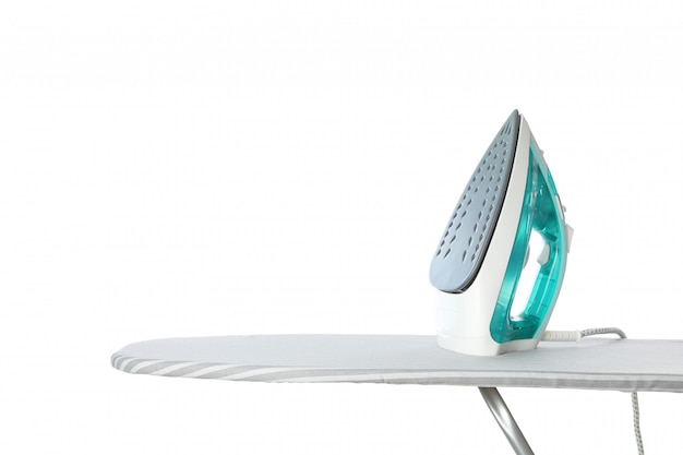 Iron on ironing board isolated on white