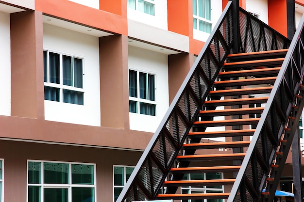 Iron stair wooden staircase with building background geomatric shape pattern abstract background