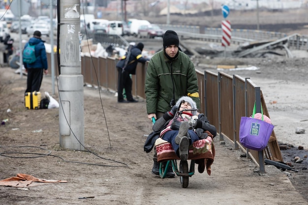 IRPIN UKRAINE Mar 09 2022 War in Ukraine Thousands of residents of Irpin have to abandon their homes and evacuate as russian troops are bombing a peaceful city War refugees in Ukraine