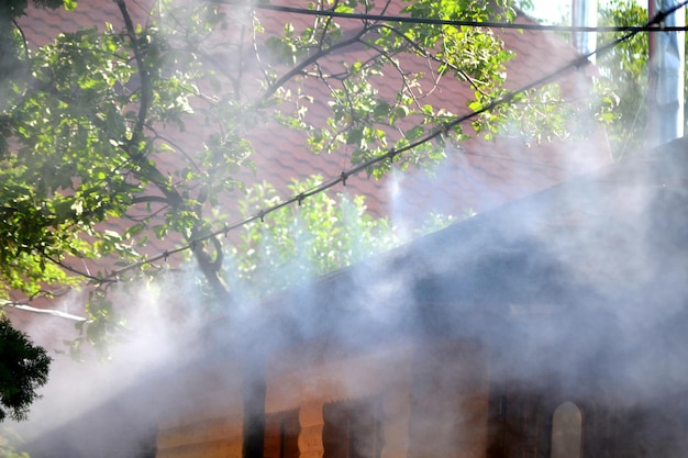 Irrigation system close-up. Humidification of air by steam on the street outdoor in a hot summer day morning